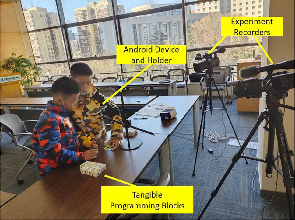 CoAR-Maze: Empowering Children's Collaborative Tangible Programming in Augmented Reality